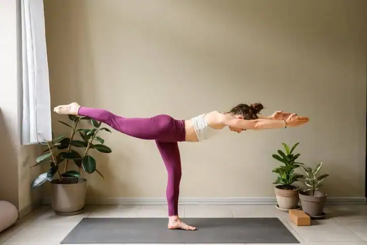 Achieving the Perfect Tone: How Often Should You Exercise for Results? 1 Woman doing Yoga exercise Harrow to help with toning the body.
