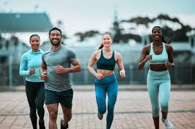 Sculpting Sleek Arms: The Essential Role of Cardio in Toning Without Bulking Up 3 image of people running to incorporate cardio Harrow exercise into their life to help tone arms and body.