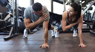 Sculpting Sleek Arms: The Essential Role of Cardio in Toning Without Bulking Up 1 Image of man and woman doing Cardio Harrow to tone their arms.